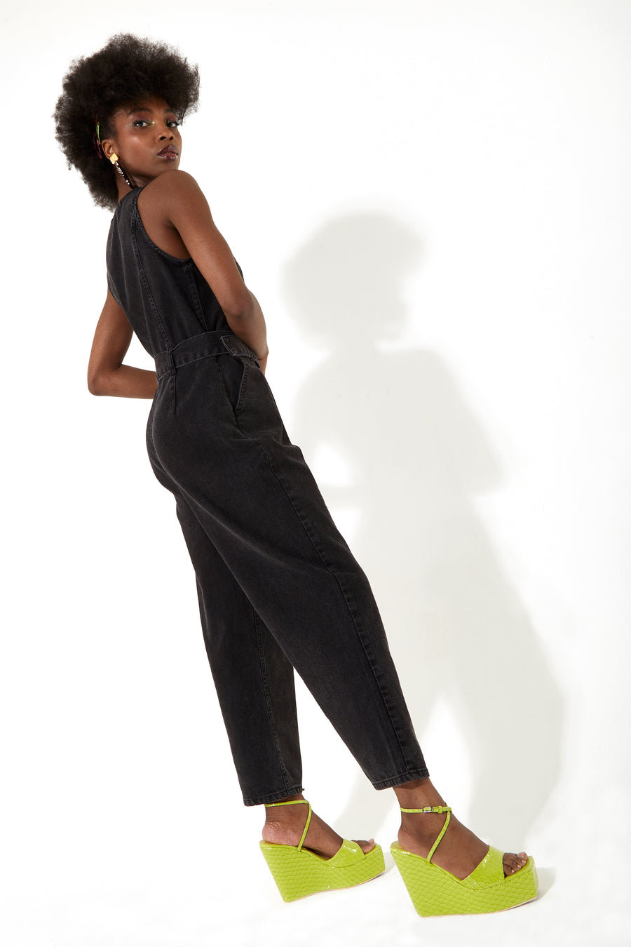 House of Holland black 90’s look denim jumpsuit with a belt and tortoise shell buttons
