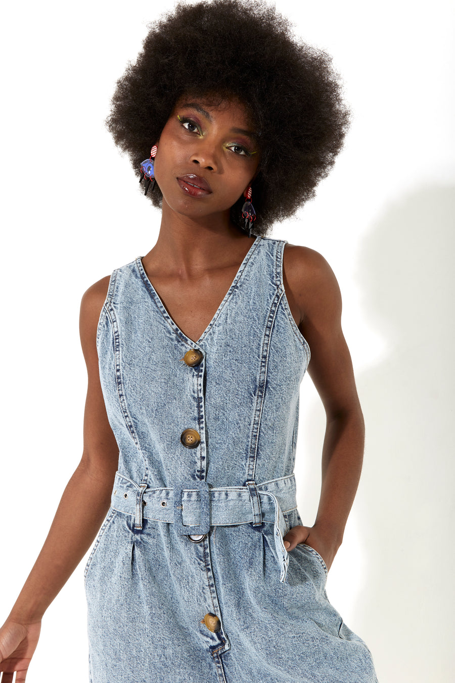 House of Holland blue 90’s look denim jumpsuit with a belt and tortoise shell buttons
