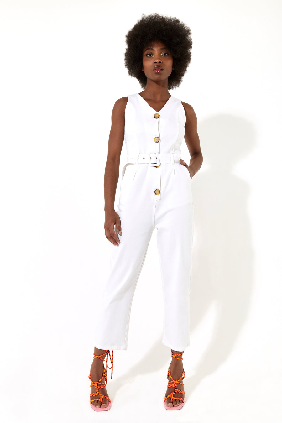 House of Holland white 90’s look denim jumpsuit with a belt and tortoise shell buttons
