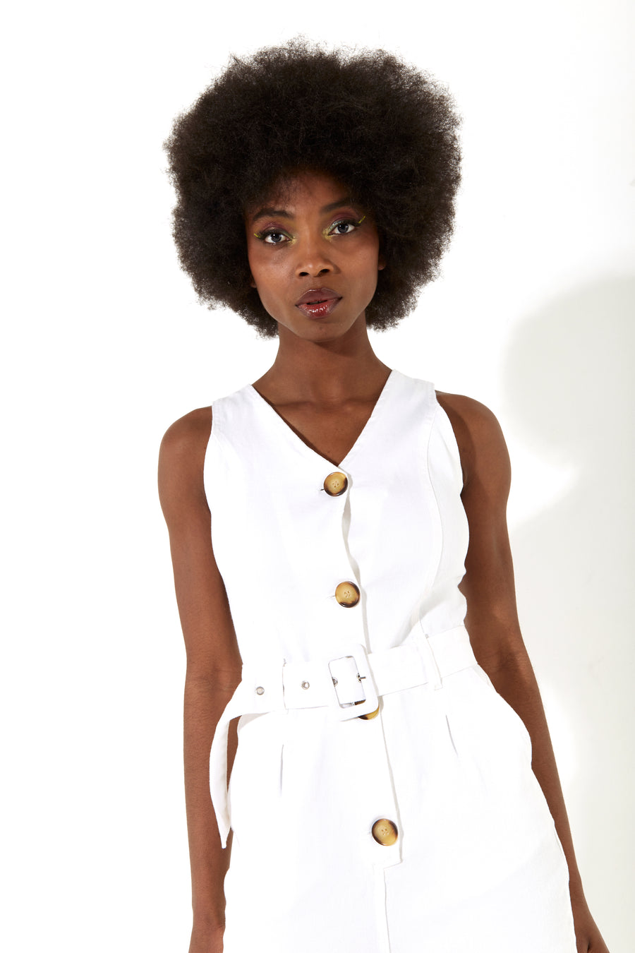 House of Holland white 90’s look denim jumpsuit with a belt and tortoise shell buttons