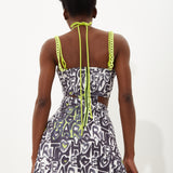 House Of Holland Abstract Print Mini Dress With Waist Cutouts With A Tie Neck And Chain Straps