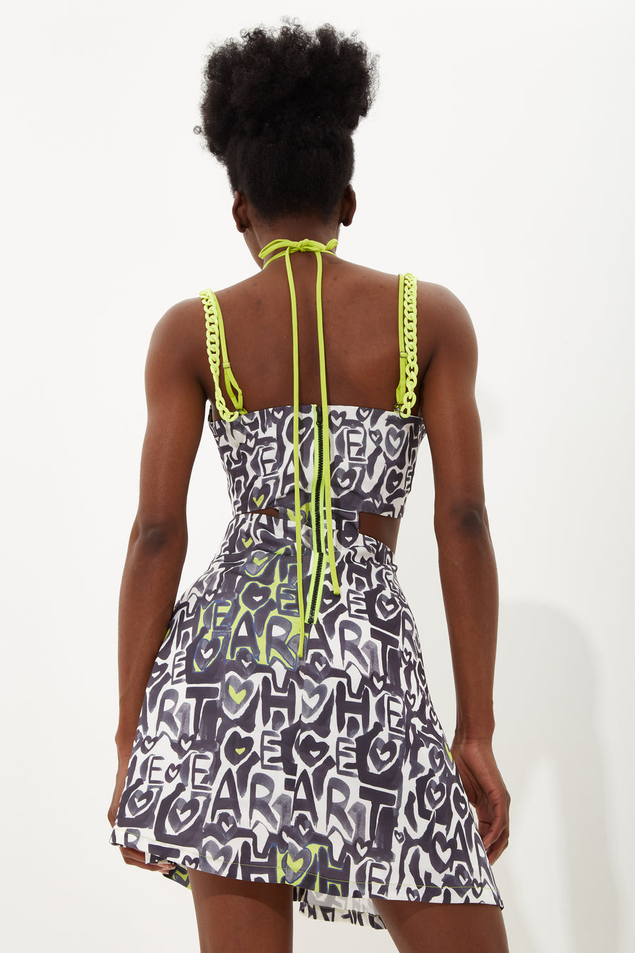 House Of Holland Abstract Print Mini Dress With Waist Cutouts With A Tie Neck And Chain Straps